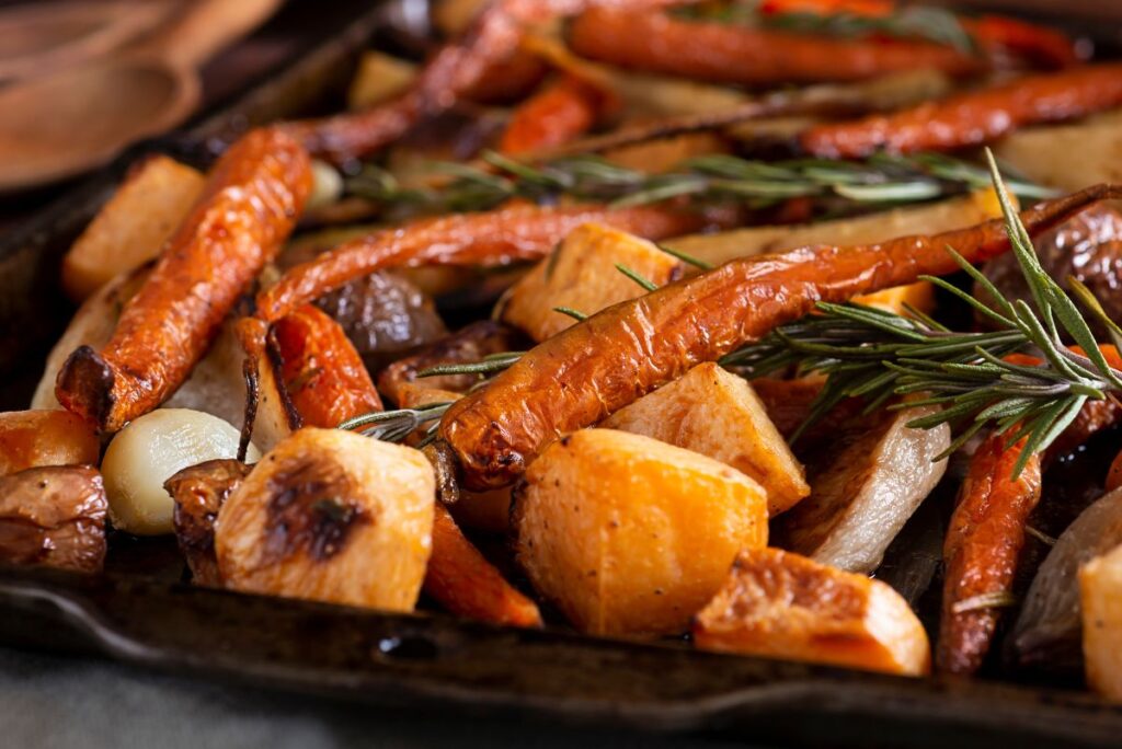 A variety of air fried vegetables on a sheet pan.