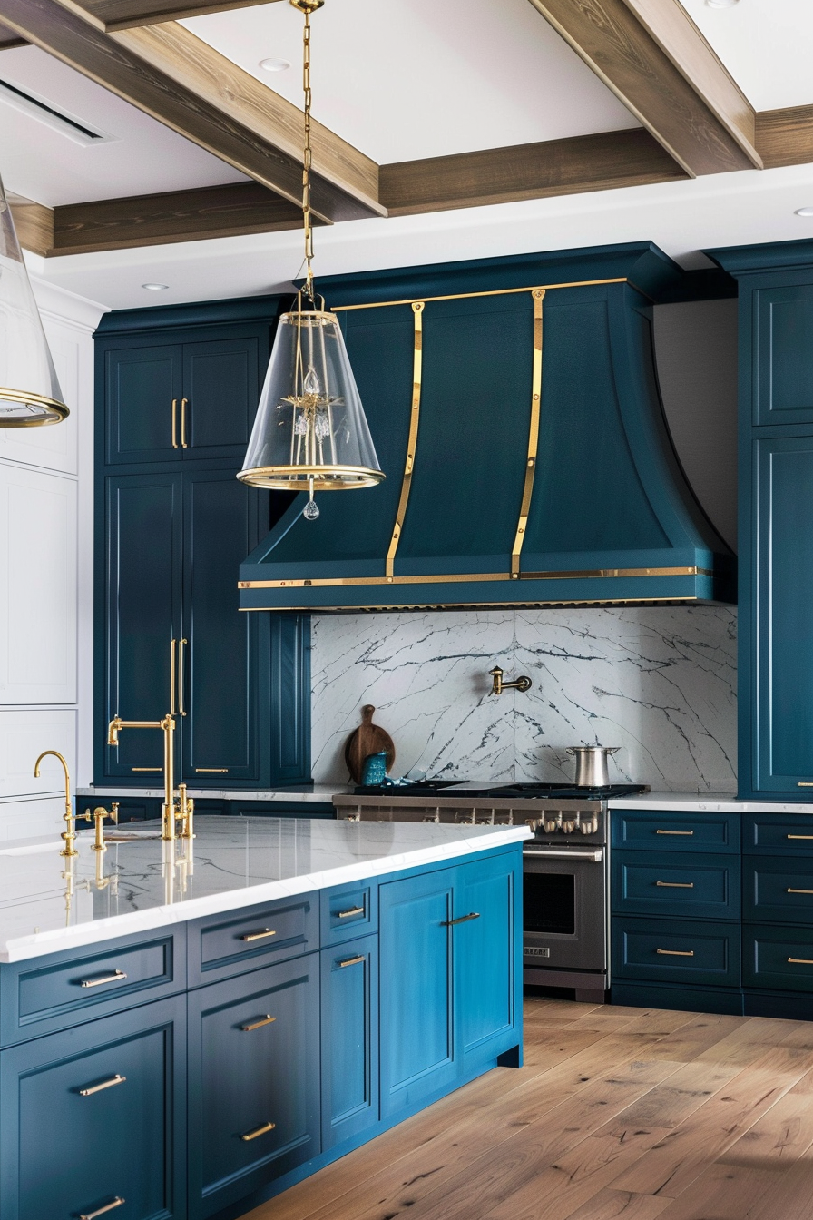 Elegant kitchen with rich blue cabinetry and brass details. The standout feature is a large blue range hood adorned with brass accents, set against a white marble backsplash with subtle gray veining. The island boasts a white marble countertop and is equipped with a brass faucet and fixtures, enhancing the luxurious feel. Glass pendant lights with brass fittings hang above the island, adding a touch of sophistication. The wooden floor and exposed ceiling beams introduce warmth and texture, creating a harmonious balance between traditional and modern design elements. The overall ambiance is refined and inviting.