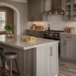 A spacious greige kitchen with hardwood flooring and tile options displayed on a sample board. Cabinets and countertops in neutral tones complement the warm, inviting space