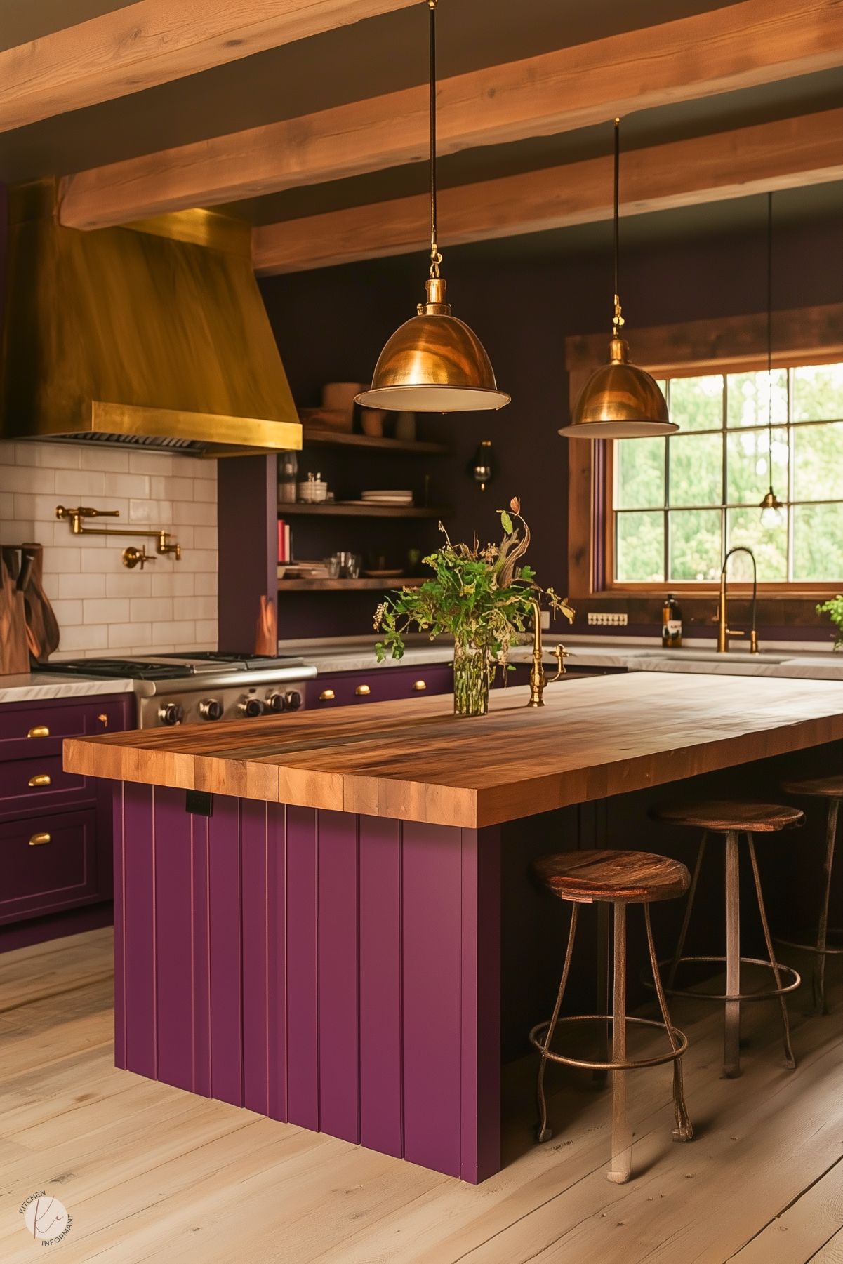 Rustic kitchen with deep purple cabinets, a warm wood island, brass accents, and industrial pendant lighting, complemented by exposed wooden beams.