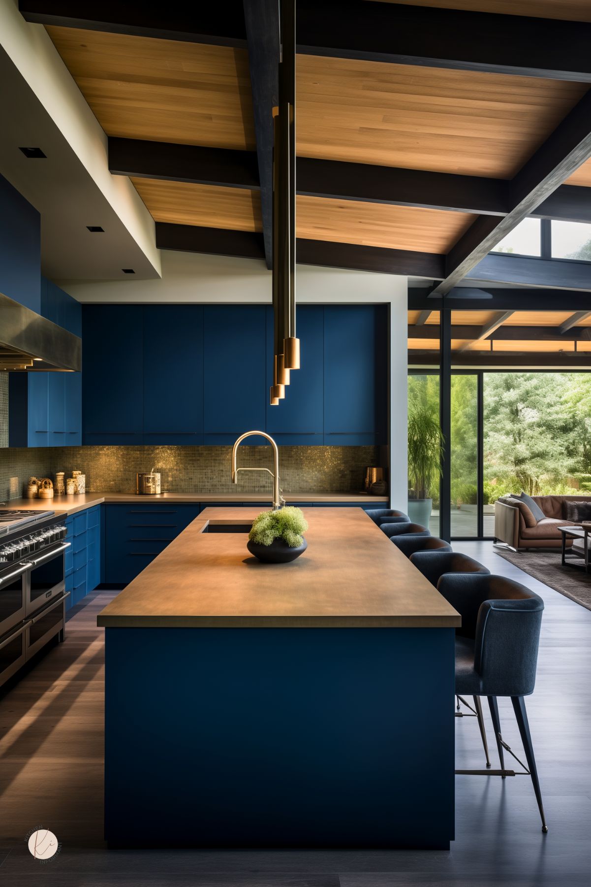 A sleek modern kitchen with navy blue cabinetry, a warm wood island countertop, and a dramatic open-beam ceiling with natural wood and black accents. Linear gold pendant lights add a sophisticated touch, while a metallic backsplash enhances the rich color palette. Navy upholstered barstools line the island, and floor-to-ceiling windows open to a lush outdoor living space, blending indoor and outdoor elegance.