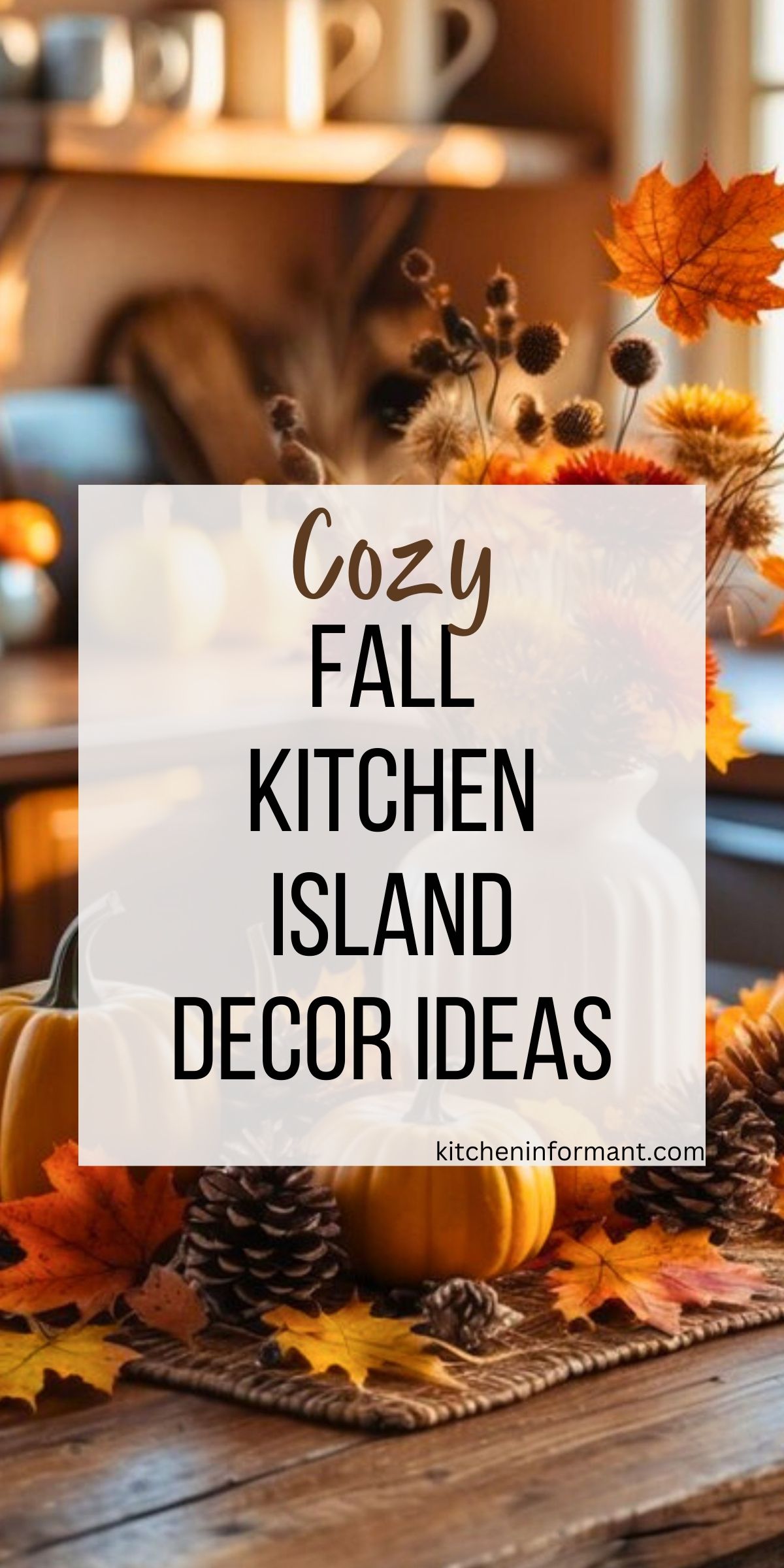 A rustic wooden kitchen island decorated for fall with small pumpkins, pinecones, and colorful autumn leaves. A white vase holds dried flowers and orange maple leaves, creating a warm seasonal centerpiece. Soft natural light and shelves with mugs in the background add to the cozy fall kitchen atmosphere.