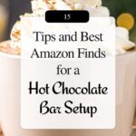 Close-up mug of hot chocolate topped with whipped cream and cocoa. Text: “15 Tips and Best Amazon Finds for a Hot Chocolate Bar Setup,” “kitcheninformant.com,” and “Save for Later.” Cozy holiday entertaining, hot cocoa bar ideas, Amazon finds, kitchen decor.