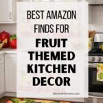 Bright white kitchen with fruit themed kitchen decor, including colorful fruit valances and under-sink curtains, a fruit floor runner, and a watermelon rug. Red and strawberry countertop accents sit beside a stainless steel stove. Text reads: “BEST AMAZON FINDS FOR FRUIT THEMED KITCHEN DECOR” and “kitcheninformant.com”.